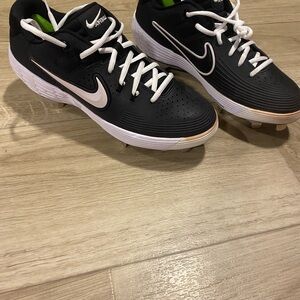 Nike Black and White Cleats with Green Accents